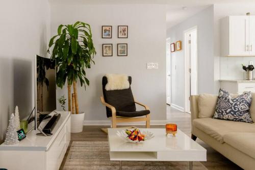 a living room with a couch and a table at Luxury 3BD Condo in the heart of Providence in Providence