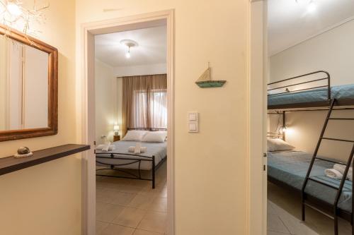 a room with two bunk beds and a hallway at Historical Old Town - Casa d'Irene in Kos