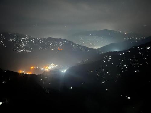 a view of a city lit up at night at Delohighs in Kalimpong