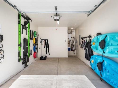 a garage with a room filled with ski equipment at Lula Inez Game Paradise townhouse in Atkinville
