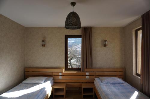 Postel nebo postele na pokoji v ubytování Mestia Panorama