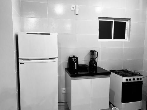 Kuchyň nebo kuchyňský kout v ubytování Apartamento Gratidão