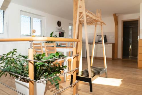 a room with a hammock in a house at Apartmány Močovice in Močovice