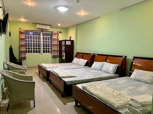 Bảo Bảo Hotel tesisinde bir odada yatak veya yataklar
