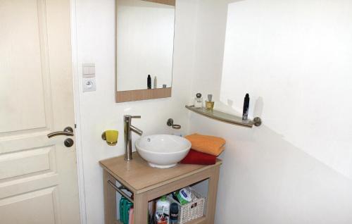 a bathroom with a sink and a mirror at Beautiful Apartment In Gemenos With Outdoor Swimming Pool in Gémenos