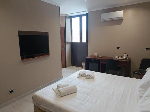 Una cama o camas en una habitación de Il Duomo