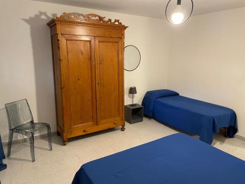 Postel nebo postele na pokoji v ubytování Giardino Ovest - a pochi passi dal mare