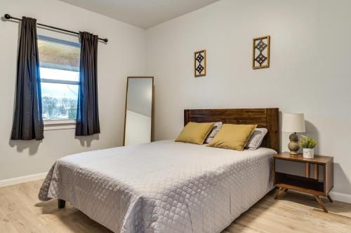 a bedroom with a large bed and a window at Modern Indianapolis Home Less Than 2 Mi to Downtown! in Indianapolis