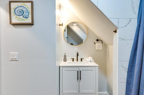 a bathroom with a sink and a mirror at Modern Indianapolis Home Less Than 2 Mi to Downtown! in Indianapolis