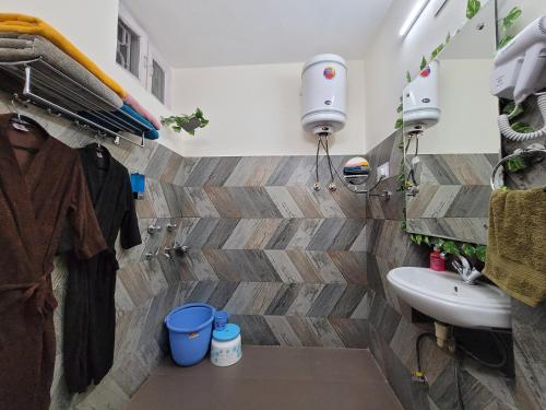 a bathroom with a toilet and a sink at Dhairya's Villa Home Away From Home in Jammu