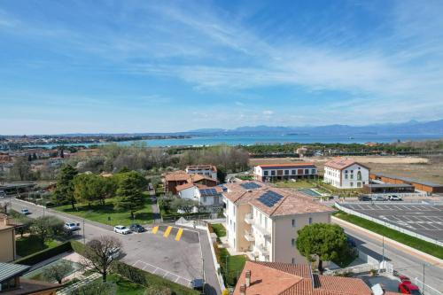 an aerial view of a town with a body of water at Ranalli Palace in Peschiera del Garda