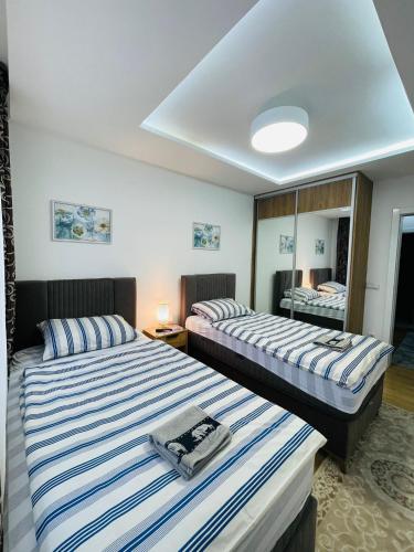 Llit o llits en una habitació de Plavo nebo