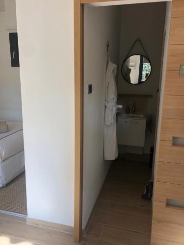 a bathroom with a mirror and a sink in a room at La Brigantine in La Ciotat