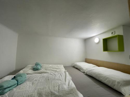 a room with two beds in a room at Brasilia apartment in Ljubljana