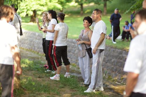 a group of people standing next to a wall at Hotel Kardial in Teslić