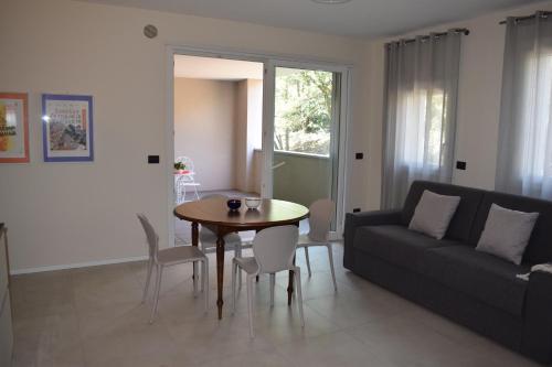 a living room with a table and a couch at MyVilla - Ivrea via Jervis 22b in Ivrea