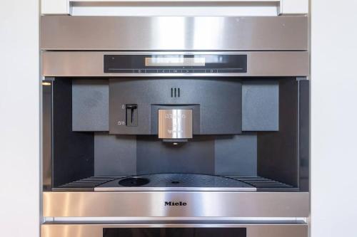 a stainless steel oven with a stove top at Old Town Square Luxury Apartment in Prague