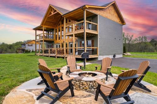 a house with a fire pit in the yard at Pet Friendly+ Hot Tub + Fire Pit + Game Room in Cosby