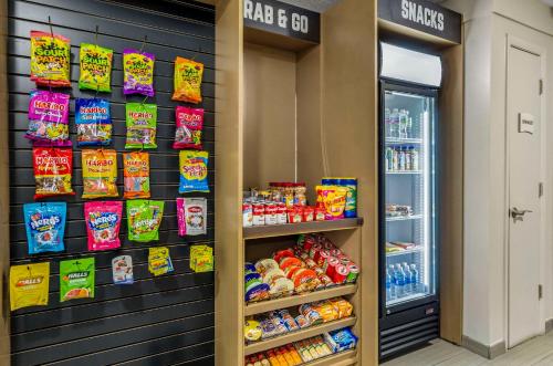 a store aisle with a display of food and snacks at Clarion Pointe Staunton East in Staunton