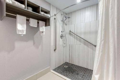 a bathroom with a shower with a shower curtain at Quality Inn in Newberry