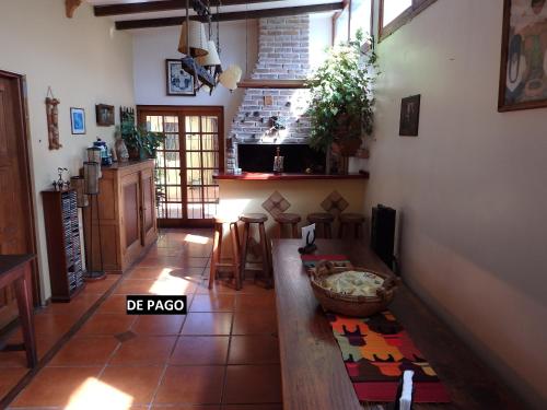 a living room with a table and a kitchen at Montelife in Montevideo