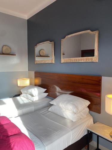 Postel nebo postele na pokoji v ubytování EZE Inn Boutique Hotel