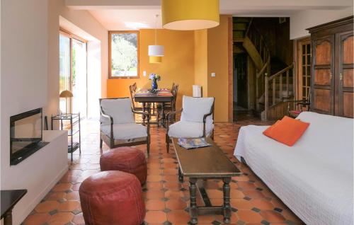 a living room with a bed and a table at Beautiful Home In Perros-guirrec With 4 Bedrooms And Wifi in Perros-Guirec