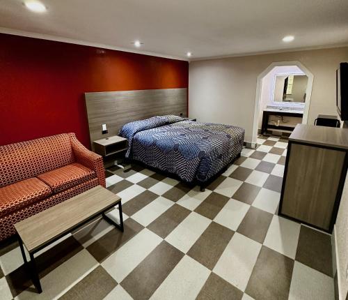 מיטה או מיטות בחדר ב-Hollywood INN - Downtown Houston