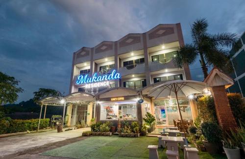a building with a sign that reads malanda at Mookanda Residence in Ao Nang Beach