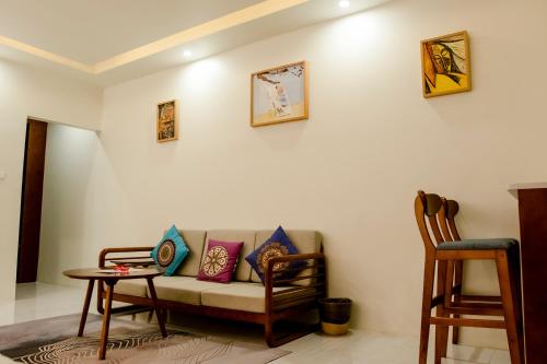 a living room with a couch and a table at Amphitrite Resort in Panglao