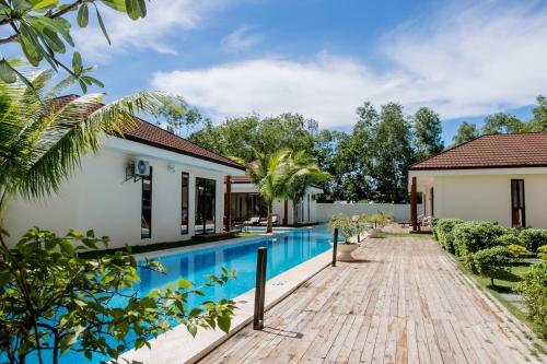 an image of a villa with a swimming pool at Amphitrite Resort in Panglao