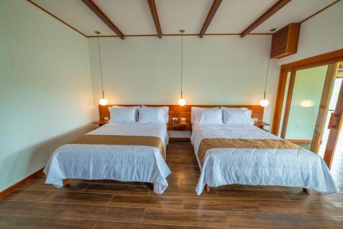 Una cama o camas en una habitación de Riosol Hotel Laguna Azul