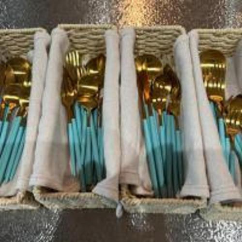 a row of blue and gold vases in a basket at Beachside base KURUWA in Yokosuka