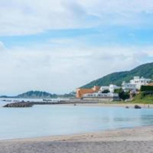 a body of water with buildings in the background at Beachside base KURUWA in Yokosuka