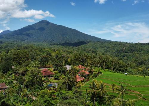 an aerial view of a resort with a mountain in the background at Sava Eco Retreat in Padangan