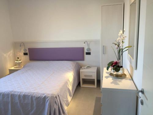 Cama ou camas em um quarto em Residence Hotel Albachiara