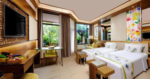 Ένα ή περισσότερα κρεβάτια σε δωμάτιο στο Regal Palace Resort & Spa