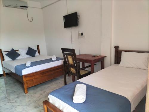 Un ou plusieurs lits dans un hébergement de l'établissement Hotel Sun Blue