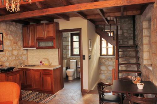 a kitchen with a staircase leading to a bathroom at Abelos Villas in Áyios Ioánnis