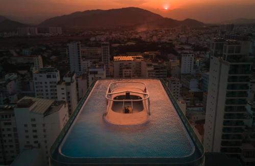 a small boat sitting on top of a building at Grand Tourane Nha Trang Hotel in Nha Trang