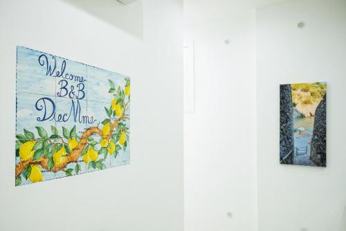 two posters on a door with a sign that reads welcome to big dog mine at B&B DieMme Amalfi Coast in Vietri sul Mare