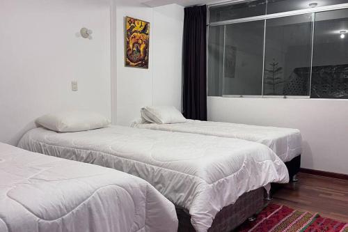 Кровать или кровати в номере APARTAMENTO RYG CUSCO