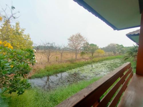 a view of a river from a window at Chatchawan Resort in Ban Tha Sao