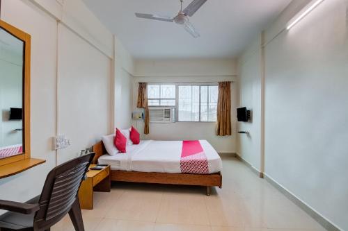 מיטה או מיטות בחדר ב-Hotel Kamini