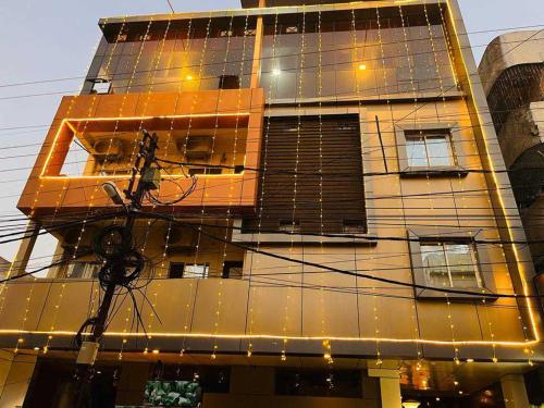 a tall building with a lot of wires in front of it at OYO Hotel Happy Homes in Bhopal