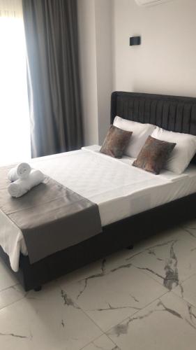 a large bed in a bedroom with a white mattress at Bavella House in Pamukkale