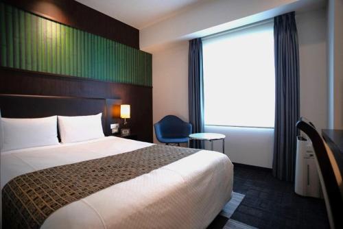 Postel nebo postele na pokoji v ubytování Hotel Bestland