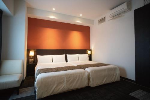 Postel nebo postele na pokoji v ubytování Hotel Bestland
