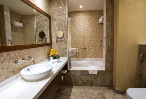  Elite Byblos Hotel -  Room  picture :   Minibar    Shower    Bath                           