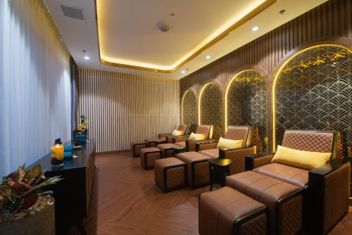 a waiting room with couches and chairs at Grand Tourane Nha Trang Hotel in Nha Trang